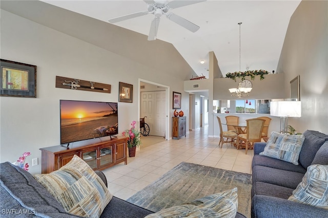 living room featuring high vaulted ceiling, ceiling fan with notable chandelier, and light tile patterned flooring