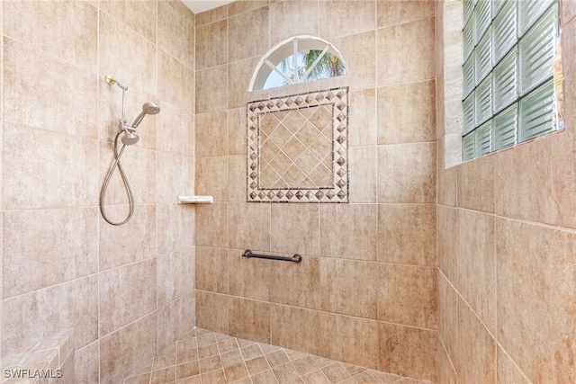 full bathroom with a tile shower