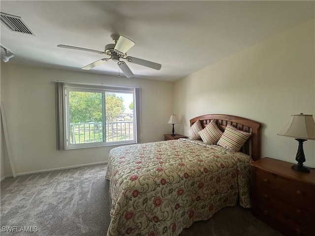 carpeted bedroom featuring baseboards, visible vents, and ceiling fan