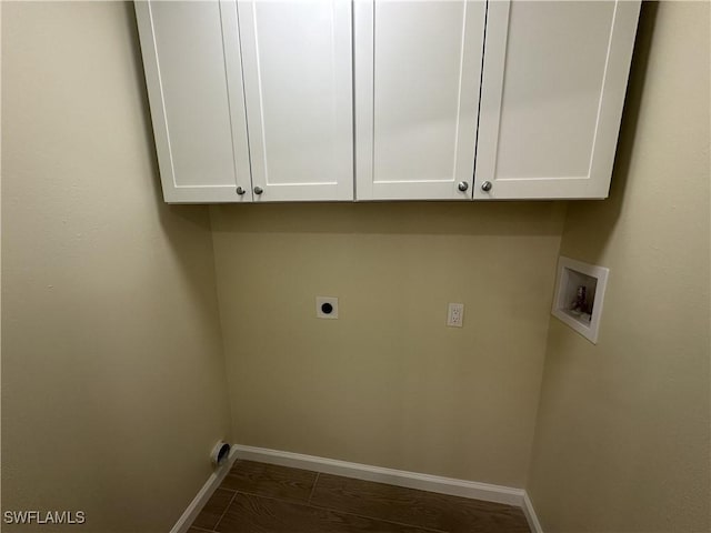 laundry room with baseboards, hookup for a washing machine, cabinet space, and hookup for an electric dryer