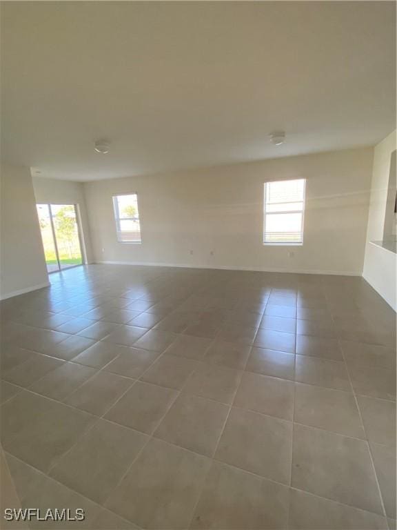 211 NE 20th St, Cape Coral, FL 33909 - unfurnished room with light tile patterned floors and baseboards