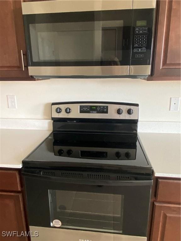 211 NE 20th St, Cape Coral, FL 33909 - kitchen with light countertops and stainless steel appliances