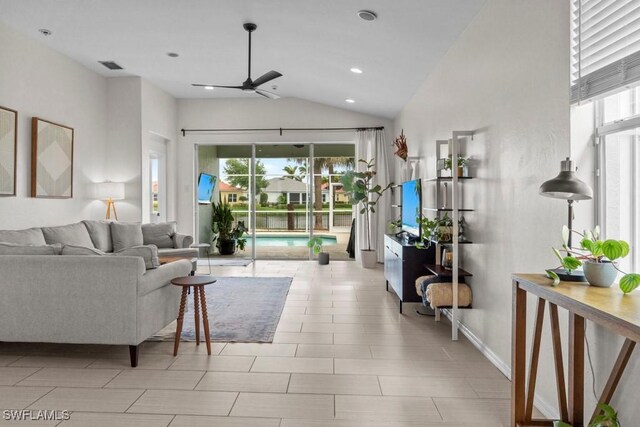 living area featuring vaulted ceiling, ceiling fan, baseboards, and recessed lighting