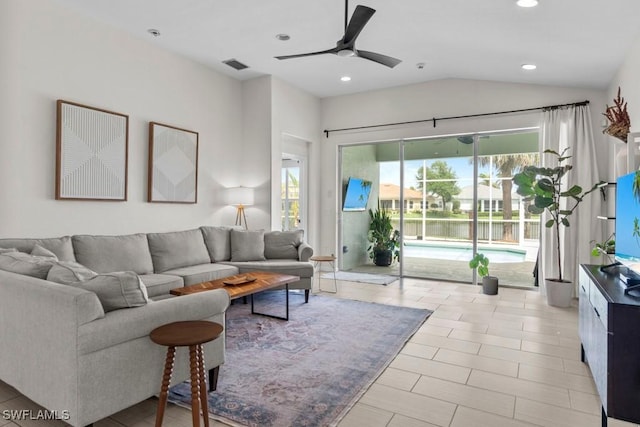 living area featuring ceiling fan, lofted ceiling, and recessed lighting