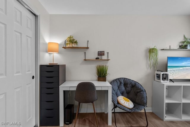 office area with wood finished floors and baseboards