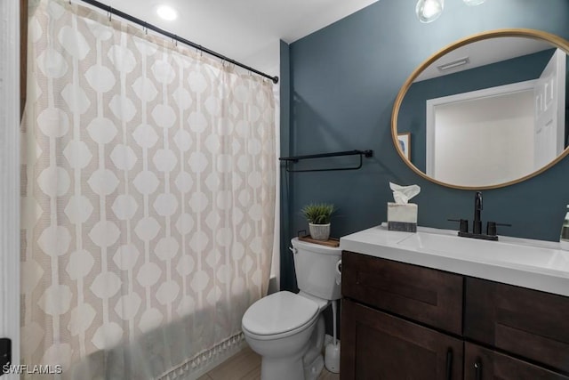 full bath with vanity, toilet, and shower / tub combo