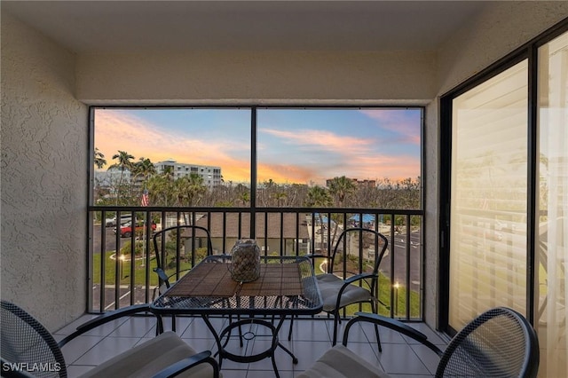 view of balcony at dusk