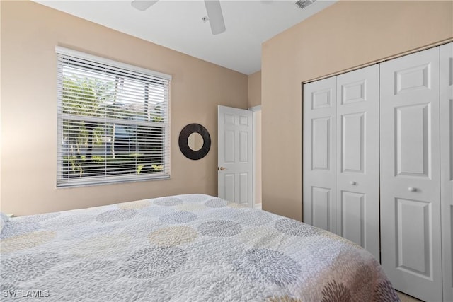 bedroom featuring visible vents, a closet, and ceiling fan