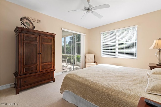 bedroom with baseboards, access to outside, light carpet, and a ceiling fan