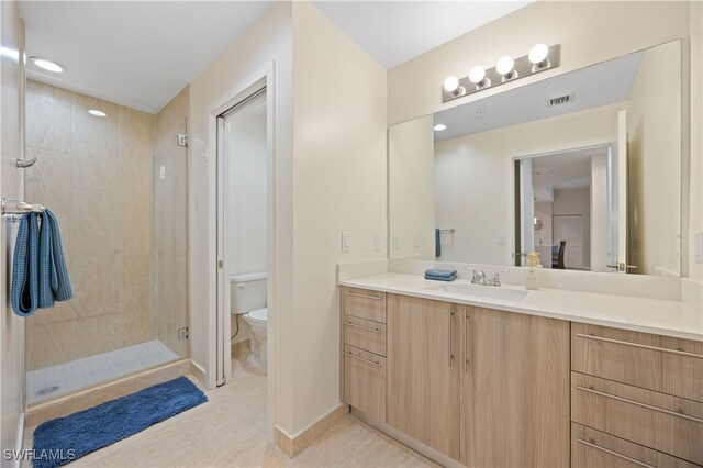 15901 Royal Pointe Ln Unit 404, Fort Myers, FL 33908 - bathroom featuring visible vents, toilet, vanity, tile patterned floors, and a stall shower