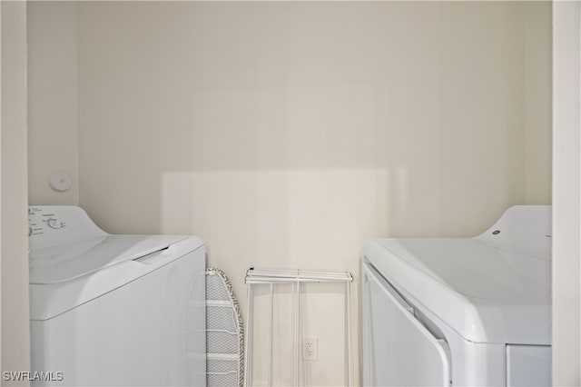 15901 Royal Pointe Ln Unit 404, Fort Myers, FL 33908 - washroom with separate washer and dryer and laundry area
