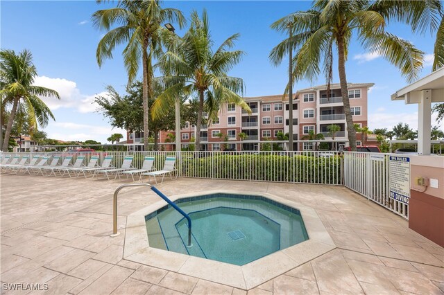 15901 Royal Pointe Ln Unit 404, Fort Myers, FL 33908 - view of pool featuring a patio, fence, and a community hot tub
