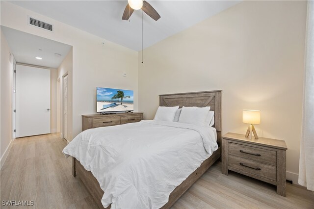 15901 Royal Pointe Ln Unit 404, Fort Myers, FL 33908 - bedroom featuring a closet, light wood finished floors, ceiling fan, and visible vents