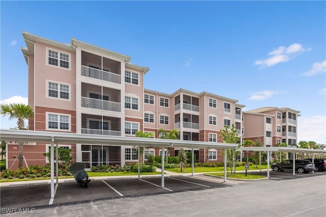 15901 Royal Pointe Ln Unit 404, Fort Myers, FL 33908 - view of property with covered parking