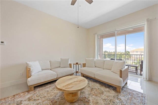 15901 Royal Pointe Ln Unit 404, Fort Myers, FL 33908 - living room with baseboards, a ceiling fan, and light tile patterned flooring