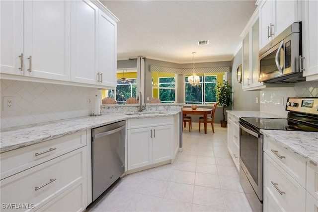 kitchen featuring a sink, stainless steel appliances, a wealth of natural light, and visible vents