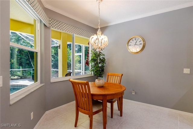 dining area featuring ornamental molding, a notable chandelier, and baseboards