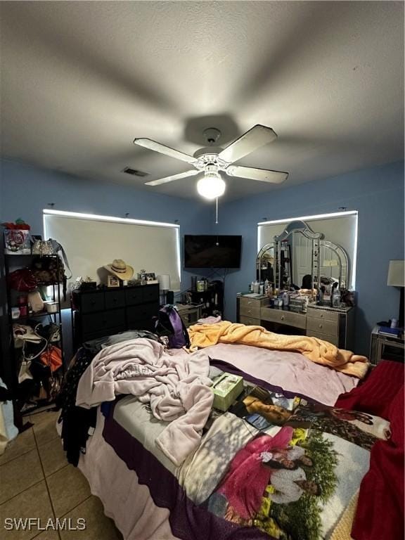 110 Clayton Ave, Lehigh Acres, FL 33936 - tiled bedroom featuring ceiling fan and visible vents