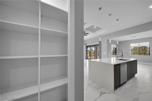 kitchen with stainless steel dishwasher, modern cabinets, marble finish floor, a sink, and a center island with sink