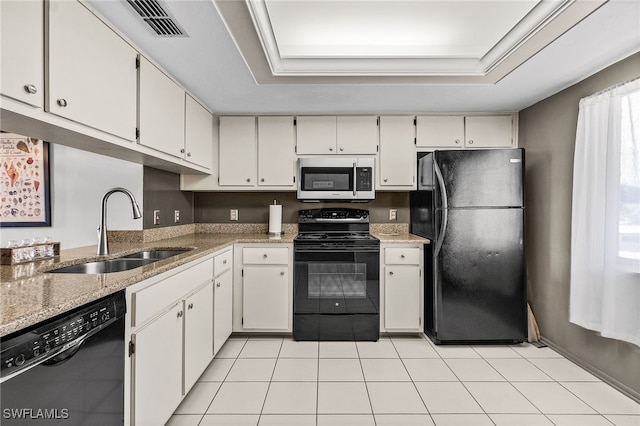 11170 Caravel Cir Unit 210, Fort Myers, FL 33908 - kitchen with a sink, black appliances, light tile patterned flooring, light stone countertops, and visible vents