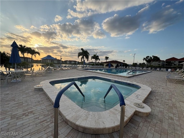 11170 Caravel Cir Unit 210, Fort Myers, FL 33908 - pool featuring a hot tub and a patio