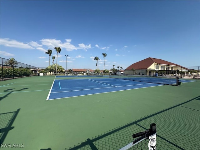 11170 Caravel Cir Unit 210, Fort Myers, FL 33908 - view of tennis court with fence and community basketball court