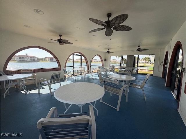 11170 Caravel Cir Unit 210, Fort Myers, FL 33908 - view of patio featuring outdoor dining area, a water view, and ceiling fan