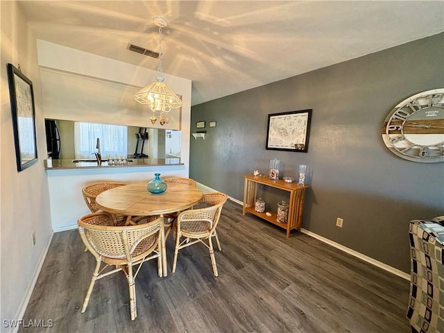 11170 Caravel Cir Unit 210, Fort Myers, FL 33908 - dining space featuring baseboards, a chandelier, wood finished floors, and visible vents