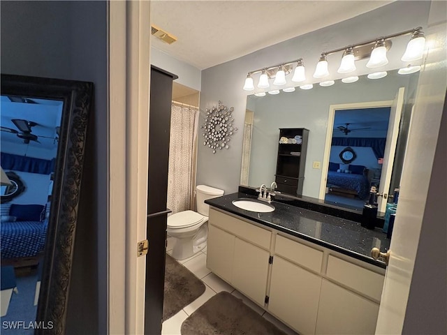 11170 Caravel Cir Unit 210, Fort Myers, FL 33908 - ensuite bathroom with ensuite bath, tile patterned flooring, vanity, and toilet