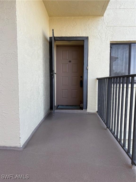 11170 Caravel Cir Unit 210, Fort Myers, FL 33908 - entrance to property featuring stucco siding