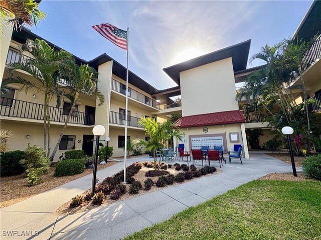 11170 Caravel Cir Unit 210, Fort Myers, FL 33908 - view of property featuring an attached garage