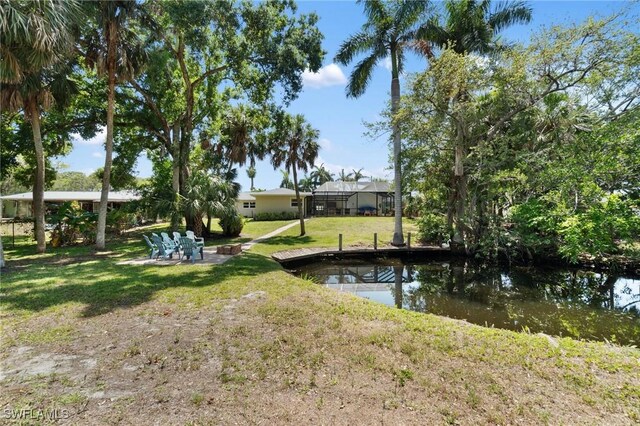 dock area featuring a lawn