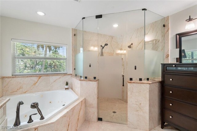bathroom featuring recessed lighting, a tub with jets, and a marble finish shower