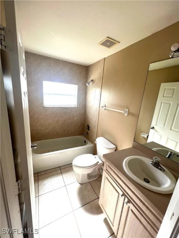 full bathroom with bathtub / shower combination, vanity, tile patterned flooring, visible vents, and toilet