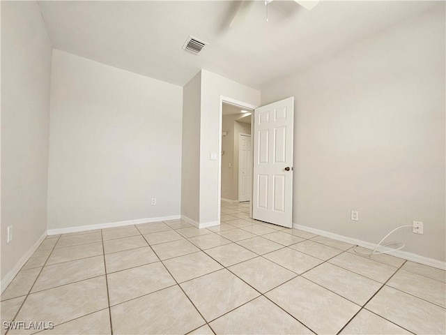 124/126 Ivan Ave S, Lehigh Acres, FL 33973 - unfurnished room with a ceiling fan, light tile patterned flooring, and baseboards