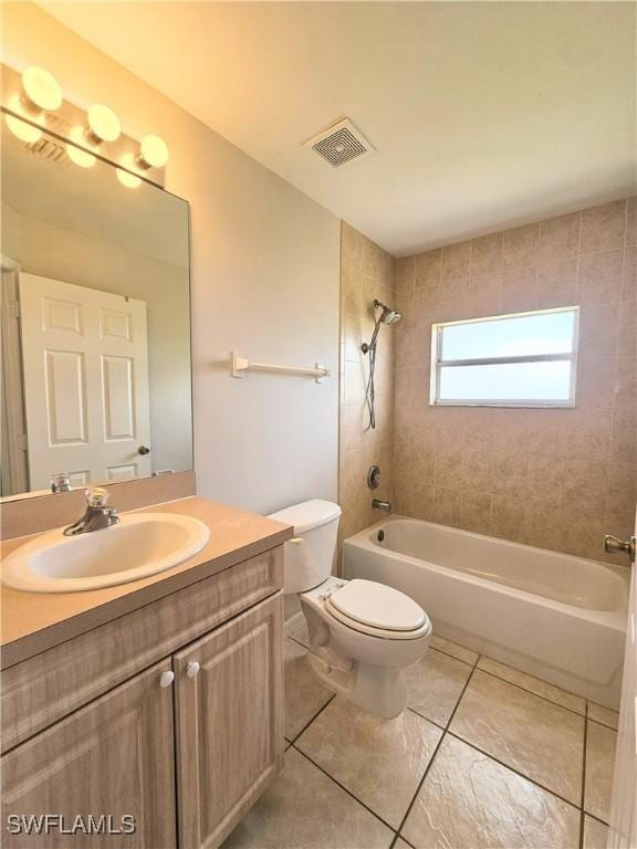 124/126 Ivan Ave S, Lehigh Acres, FL 33973 - full bath with toilet, shower / washtub combination, vanity, and tile patterned flooring