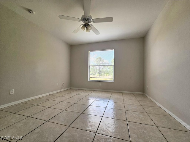 124/126 Ivan Ave S, Lehigh Acres, FL 33973 - unfurnished room with light tile patterned floors, ceiling fan, a smoke detector, and baseboards