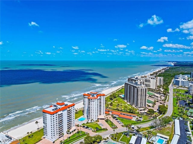 birds eye view of property with a view of city and a water view