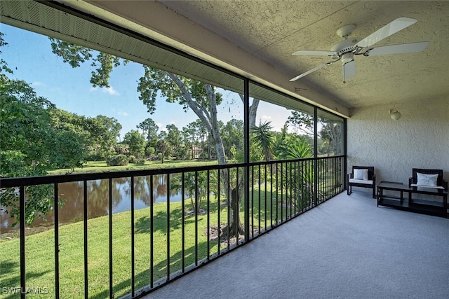 1211 Commonwealth Cir Unit C202, Naples, FL 34116 - unfurnished sunroom with a ceiling fan and a water view