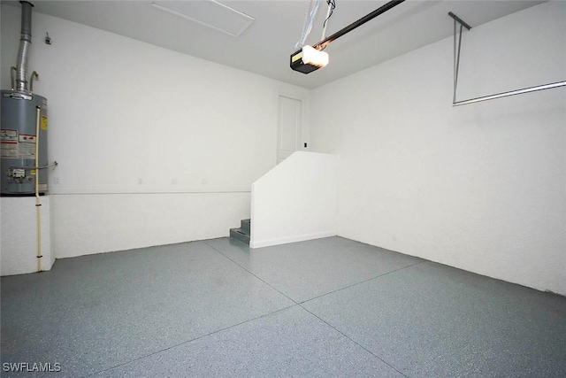 garage featuring water heater and a garage door opener
