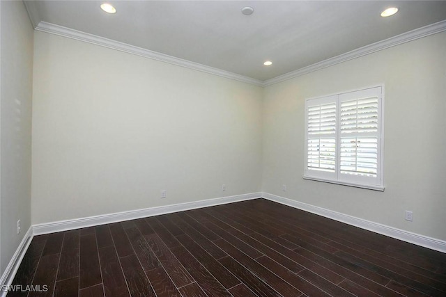 spare room featuring dark wood-style flooring, baseboards, ornamental molding, and recessed lighting