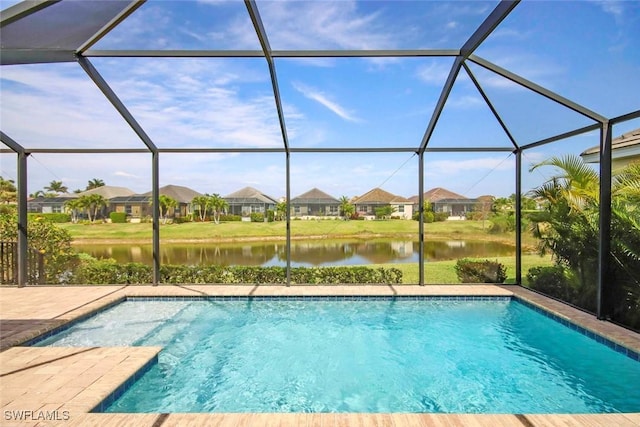 outdoor pool with a water view, a residential view, and a lanai