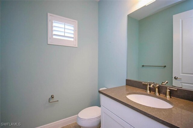 half bath with toilet and vanity