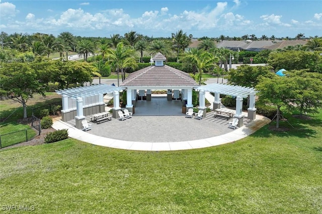 back of property with a pergola and a gazebo