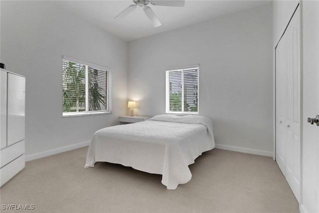 7654 Pebble Creek Cir Unit 5-301, Naples, FL 34108 - bedroom featuring ceiling fan, a closet, light colored carpet, and baseboards