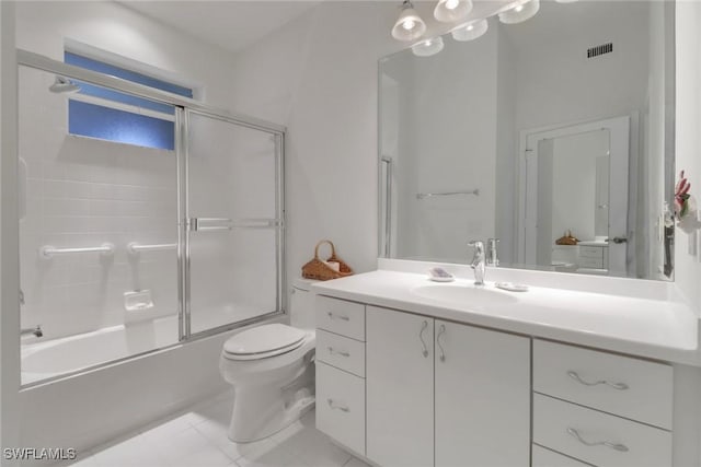 7654 Pebble Creek Cir Unit 5-301, Naples, FL 34108 - bathroom with vanity, tile patterned flooring, visible vents, toilet, and bath / shower combo with glass door