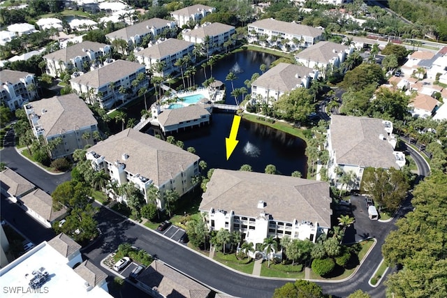 7654 Pebble Creek Cir Unit 5-301, Naples, FL 34108 - bird's eye view with a water view and a residential view