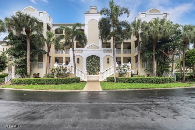7654 Pebble Creek Cir Unit 5-301, Naples, FL 34108 - view of building exterior with stairway