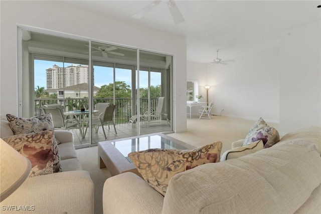 7654 Pebble Creek Cir Unit 5-301, Naples, FL 34108 - living room featuring carpet flooring, baseboards, and a ceiling fan