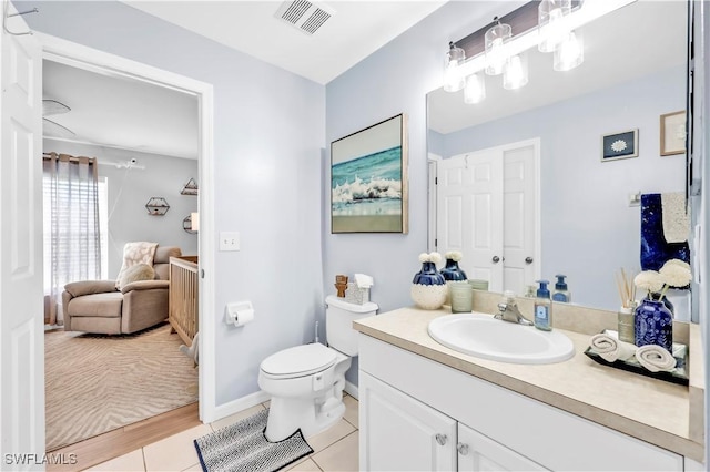 11741 Red Hibiscus Dr, Bonita Springs, FL 34135 - bathroom with vanity, baseboards, tile patterned flooring, toilet, and visible vents